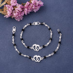 Load image into Gallery viewer, Silver Kids Bracelet with Baby Feet Charm &amp; Black Beads
